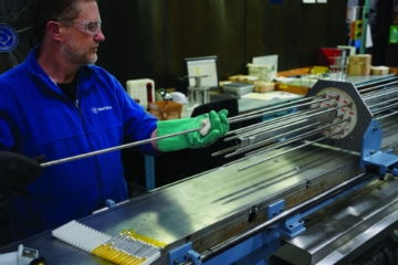 Westinghouse personnel assemble cobalt target rodlets during manufacturing of a COBA assembly for Co-60 production in commercial nuclear reactors